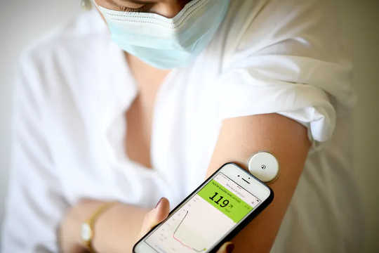 A woman measures her blood sugar level during lockdown in Paris in March 2020. (covid 19 reveals how obesity harms the body in real time not just over a lifetime)