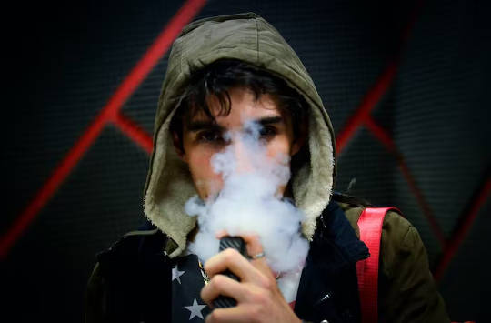 a photo of someone vaping