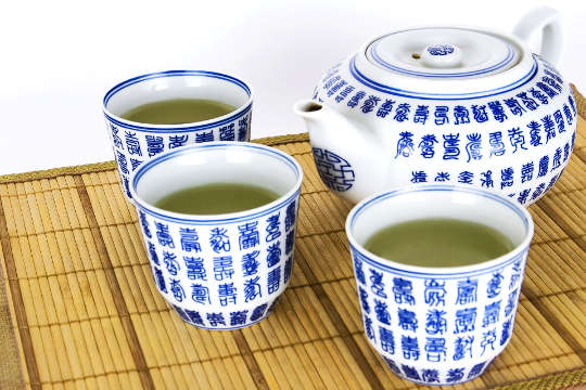 tea swerved in traditional cups and teapot